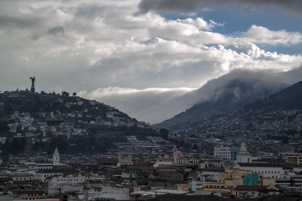 Clouds make there way over a nearby volcano as they head towards the city