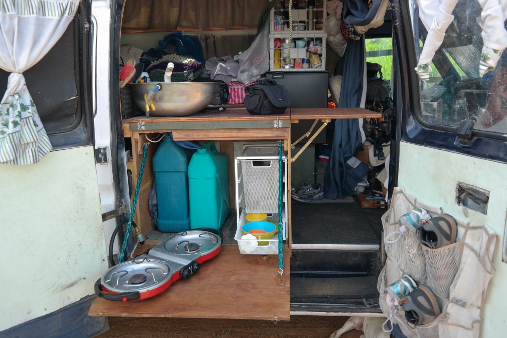 Fresh and grey water, storage baskets pull out inside or out, fold out table for cooking